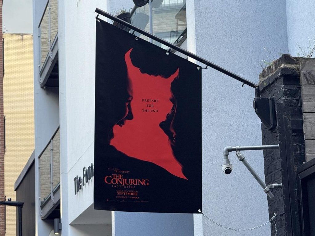 Close-up of a hanging The Conjuring: Last Rites sign reading ‘Prepare for the End’