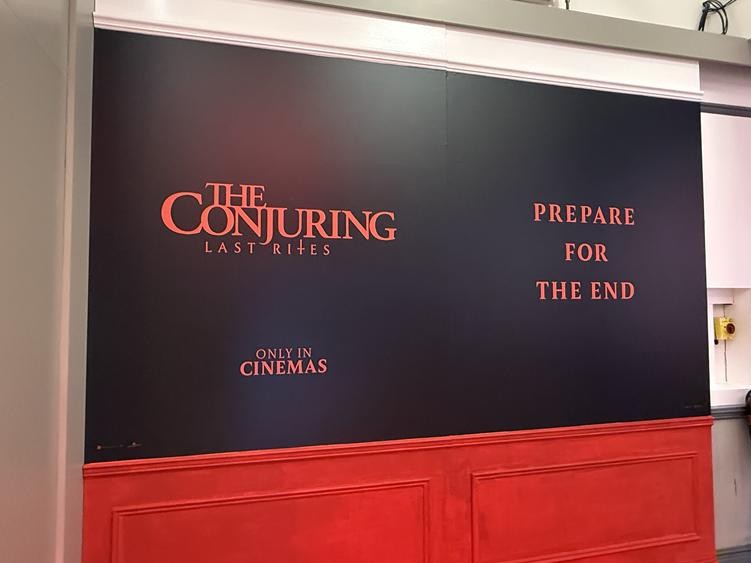 Interior display wall reading ‘The Conjuring: Last Rites – Prepare for the End’