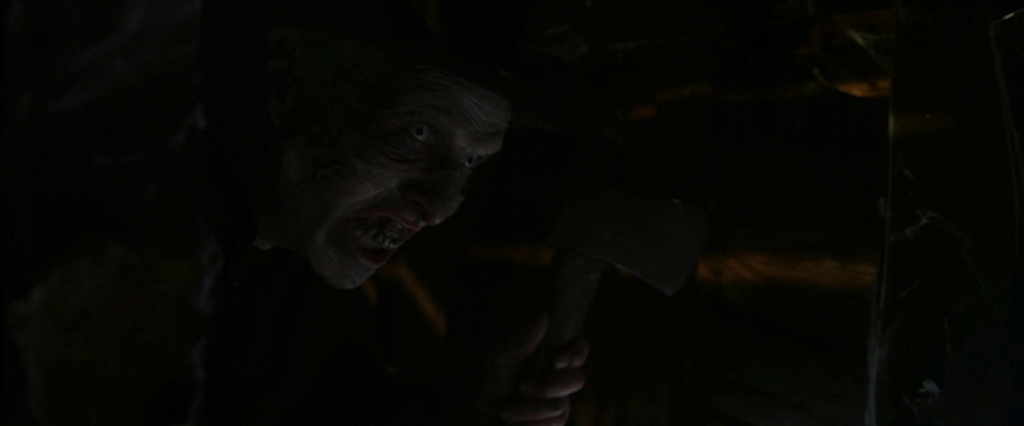 Menacing figure holding an axe in a crawlspace